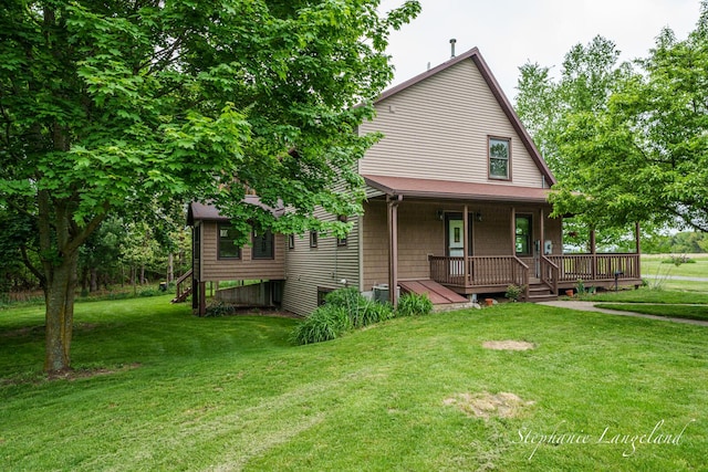 16913 Penny Ave NE, Sand Lake, MI 49343 - rustic home featuring covered porch, a front yard, and cooling unit