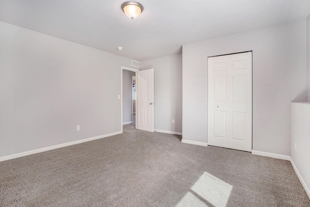 10315 Hatch Ln, Galesburg, MI 49053 - unfurnished bedroom featuring carpet flooring, baseboards, and a closet