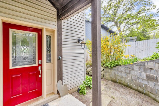 186 Goldsmith Dr, Clarklake, MI 49234 - doorway to property featuring fence