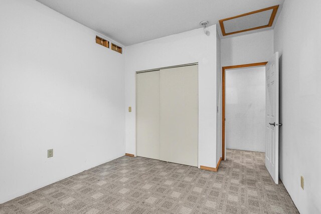 186 Goldsmith Dr, Clarklake, MI 49234 - unfurnished bedroom with a closet and attic access