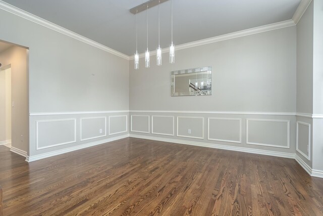 7294 Mackenzie Ln, Portage, MI 49024 - unfurnished dining area featuring ornamental molding, dark wood-type flooring, a wainscoted wall, and a decorative wall