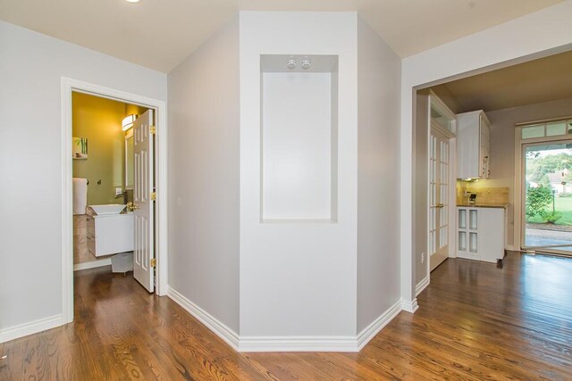 7294 Mackenzie Ln, Portage, MI 49024 - hallway featuring wood finished floors and baseboards