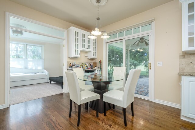 7294 Mackenzie Ln, Portage, MI 49024 - dining area with healthy amount of natural light, dark wood finished floors, and baseboards