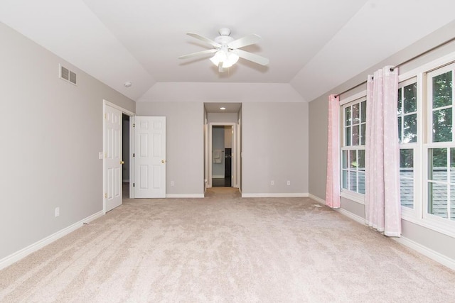 7294 Mackenzie Ln, Portage, MI 49024 - unfurnished bedroom featuring light carpet, baseboards, and vaulted ceiling