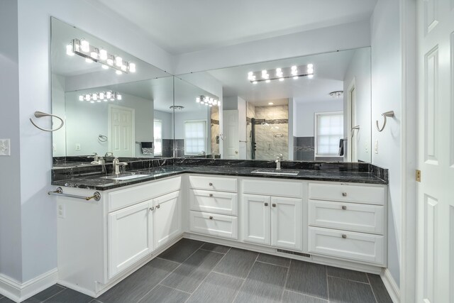7294 Mackenzie Ln, Portage, MI 49024 - full bath with a stall shower and double vanity