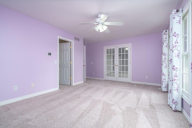 7294 Mackenzie Ln, Portage, MI 49024 - unfurnished bedroom with carpet floors, french doors, baseboards, and ceiling fan