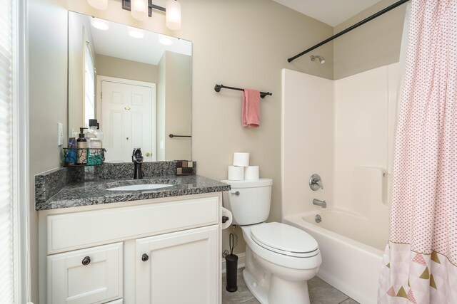 7294 Mackenzie Ln, Portage, MI 49024 - full bathroom featuring shower / tub combo, toilet, vanity, and tile patterned floors