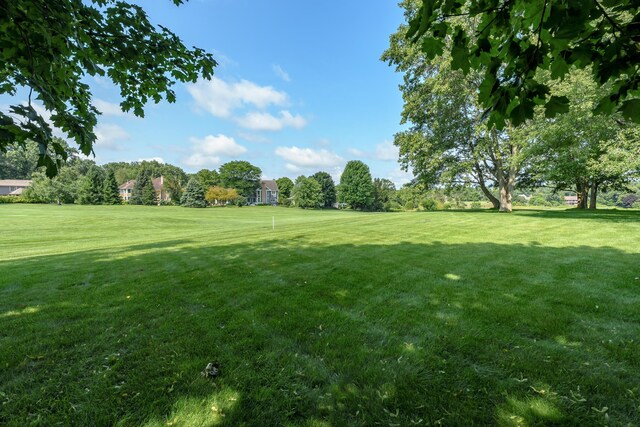 7294 Mackenzie Ln, Portage, MI 49024 - view of grassy yard featuring view of scattered trees