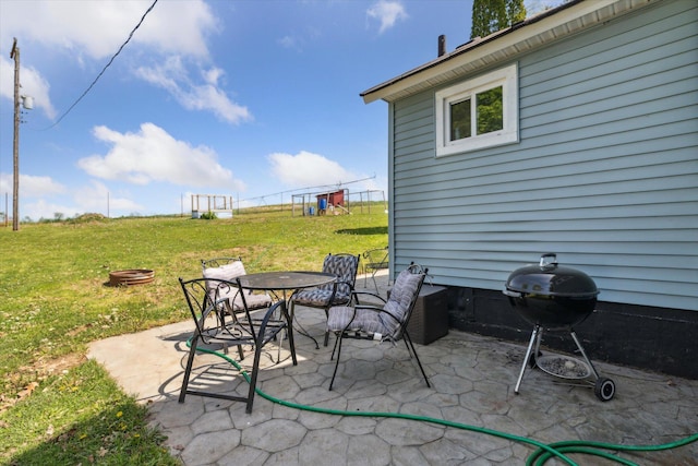 view of patio with grilling area and outdoor dining area