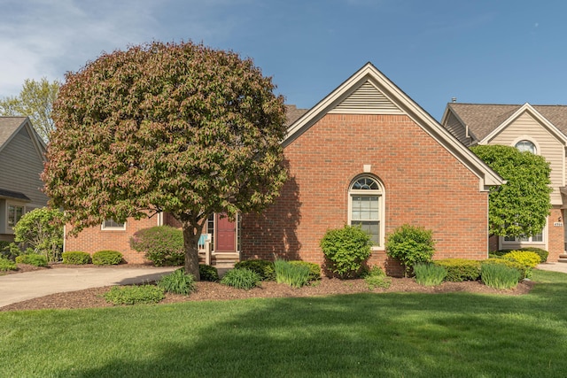4980 Doral Dr, Ann Arbor, MI 48108 - view of front of home with a front yard and brick siding