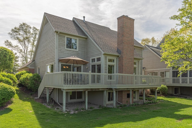 4980 Doral Dr, Ann Arbor, MI 48108 - back of house with a yard, a chimney, a deck, and roof with shingles
