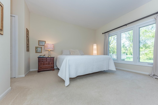 4980 Doral Dr, Ann Arbor, MI 48108 - bedroom featuring light colored carpet and baseboards