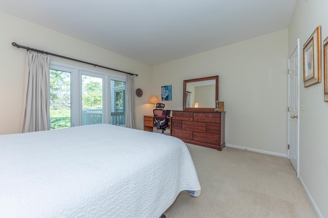 4980 Doral Dr, Ann Arbor, MI 48108 - bedroom featuring light carpet and baseboards