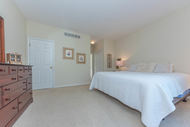 4980 Doral Dr, Ann Arbor, MI 48108 - bedroom with light colored carpet, baseboards, and a closet