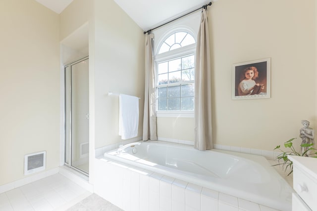 4980 Doral Dr, Ann Arbor, MI 48108 - bathroom featuring a stall shower and a garden tub