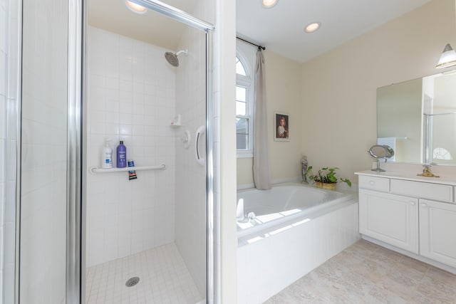 4980 Doral Dr, Ann Arbor, MI 48108 - full bath with a stall shower, a garden tub, recessed lighting, vanity, and tile patterned floors