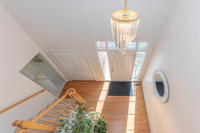 4980 Doral Dr, Ann Arbor, MI 48108 - entryway with wood finished floors and a towering ceiling