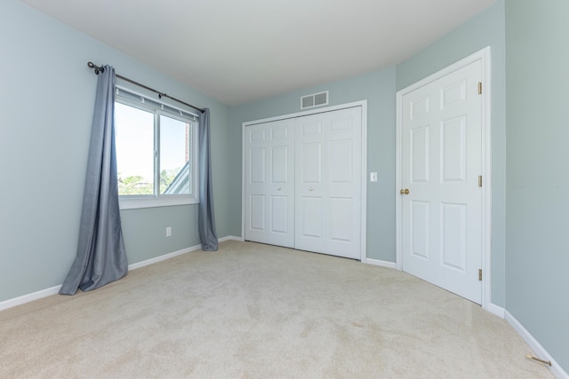 4980 Doral Dr, Ann Arbor, MI 48108 - unfurnished bedroom with carpet flooring, baseboards, and a closet
