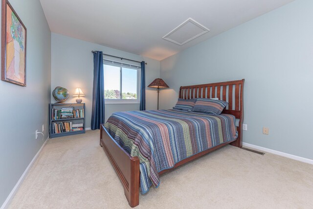 4980 Doral Dr, Ann Arbor, MI 48108 - bedroom with carpet flooring, attic access, and baseboards
