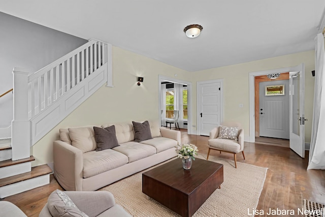 205 N Franklin St, Greenville, MI 48838 - living area with stairway and wood finished floors