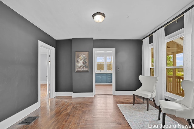 205 N Franklin St, Greenville, MI 48838 - living area featuring baseboards and wood finished floors