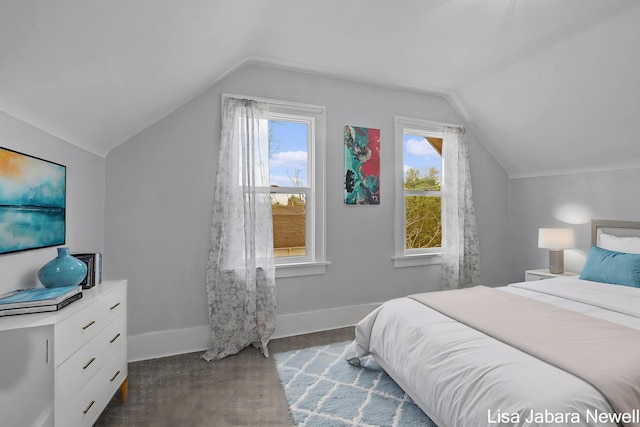205 N Franklin St, Greenville, MI 48838 - bedroom featuring lofted ceiling, baseboards, and carpet floors