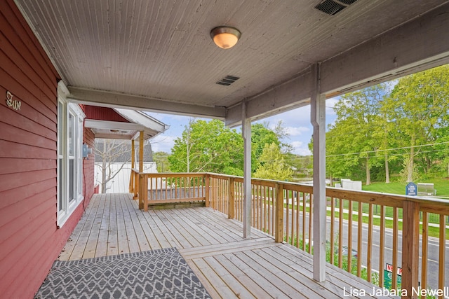 205 N Franklin St, Greenville, MI 48838 - deck with view of scattered trees