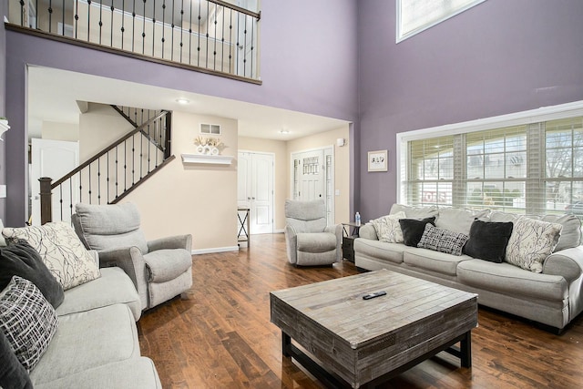 9908 Mariner St, Portage, MI 49002 - living area with a towering ceiling, wood finished floors, stairway, and baseboards