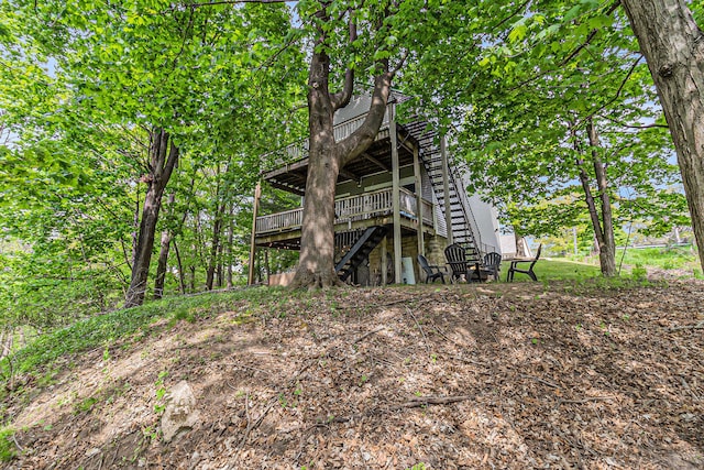 524 S Mears Ave, Whitehall, MI 49461 - back of house featuring a wooden deck and stairway