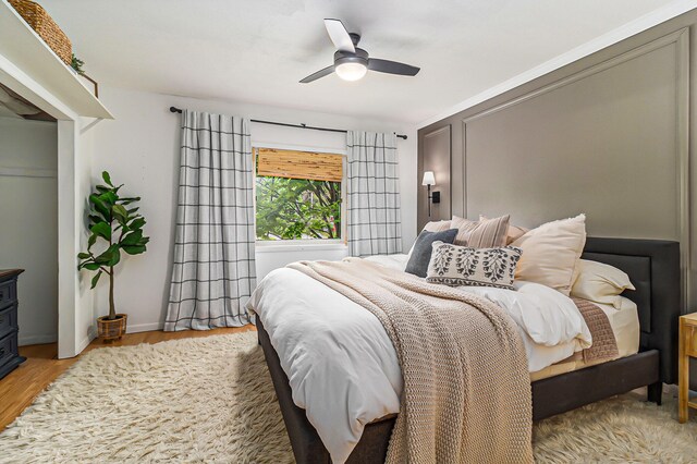 524 S Mears Ave, Whitehall, MI 49461 - bedroom with light wood-type flooring, a ceiling fan, and baseboards