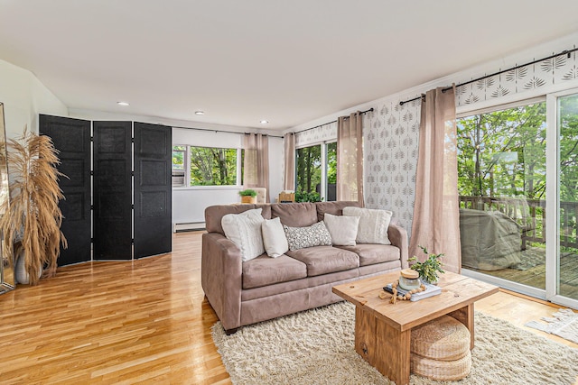 524 S Mears Ave, Whitehall, MI 49461 - living area featuring baseboard heating and light wood-style floors