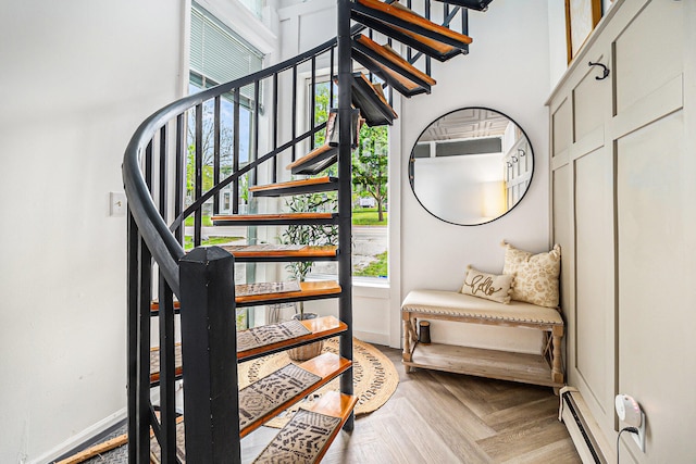 524 S Mears Ave, Whitehall, MI 49461 - stairs featuring baseboards and a baseboard radiator