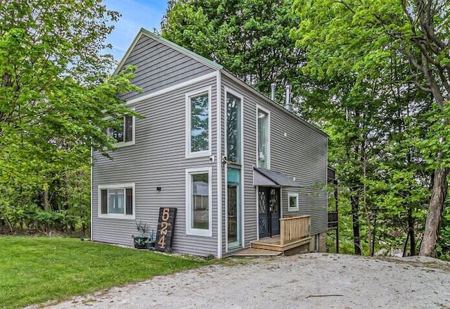 524 S Mears Ave, Whitehall, MI 49461 - view of property exterior featuring a yard