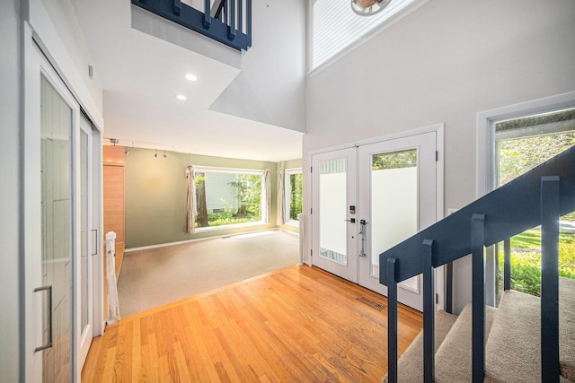 1410 N Folkstone Ct, Ann Arbor, MI 48105 - entryway featuring a high ceiling, french doors, wood finished floors, and recessed lighting
