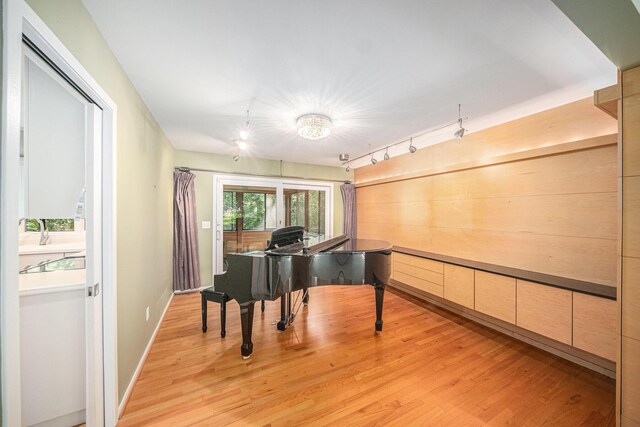 1410 N Folkstone Ct, Ann Arbor, MI 48105 - sitting room featuring rail lighting, light wood finished floors, and a chandelier