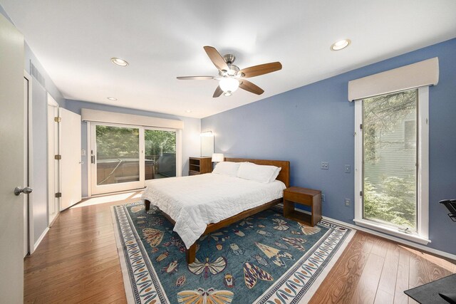 1410 N Folkstone Ct, Ann Arbor, MI 48105 - bedroom with access to outside, wood finished floors, recessed lighting, ceiling fan, and baseboards