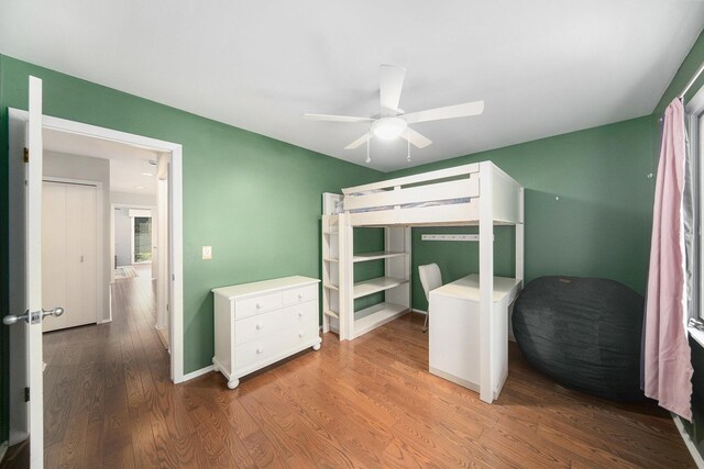 1410 N Folkstone Ct, Ann Arbor, MI 48105 - bedroom featuring wood finished floors, a ceiling fan, and baseboards
