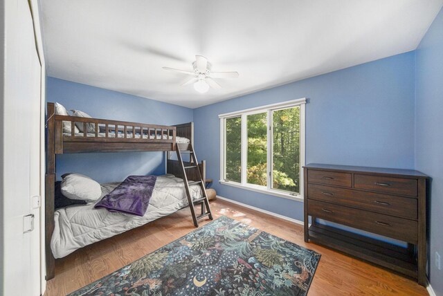 1410 N Folkstone Ct, Ann Arbor, MI 48105 - bedroom featuring baseboards, ceiling fan, and wood finished floors