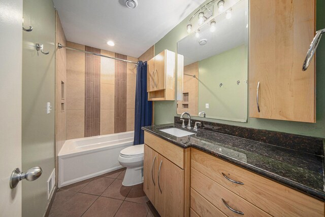 1410 N Folkstone Ct, Ann Arbor, MI 48105 - bathroom featuring toilet, tile patterned flooring, shower / bath combo with shower curtain, and vanity