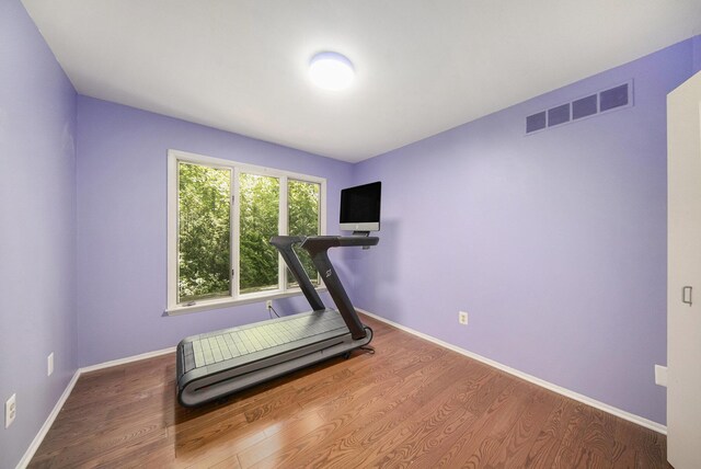 1410 N Folkstone Ct, Ann Arbor, MI 48105 - exercise area with wood finished floors and baseboards