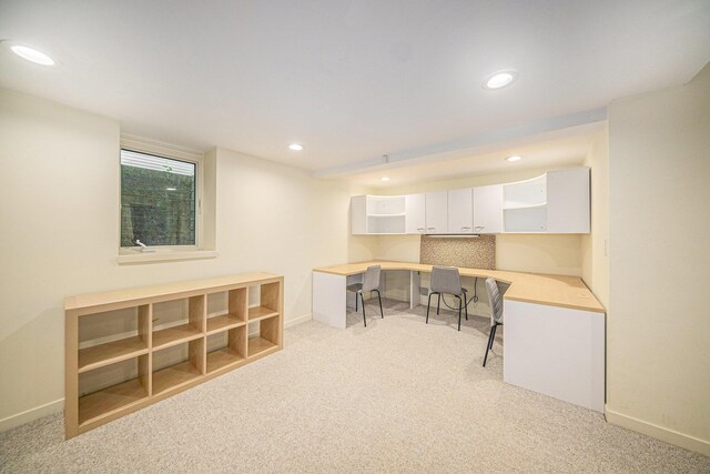 1410 N Folkstone Ct, Ann Arbor, MI 48105 - home office featuring light carpet, recessed lighting, baseboards, and built in desk