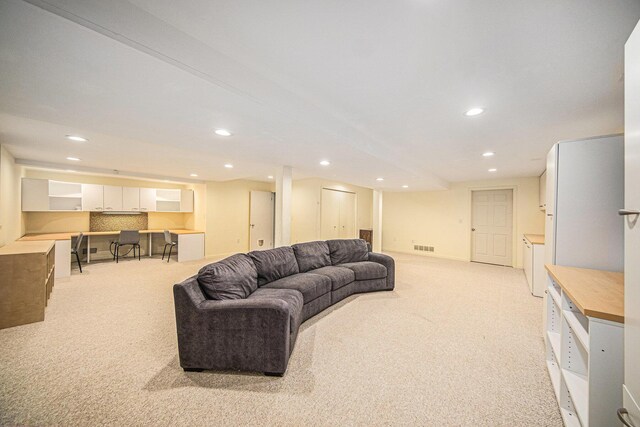 1410 N Folkstone Ct, Ann Arbor, MI 48105 - living room featuring light colored carpet and recessed lighting