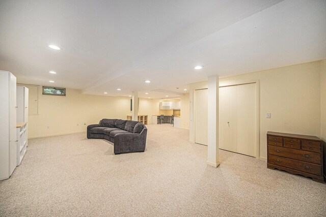 1410 N Folkstone Ct, Ann Arbor, MI 48105 - living room with light carpet, recessed lighting, and baseboards