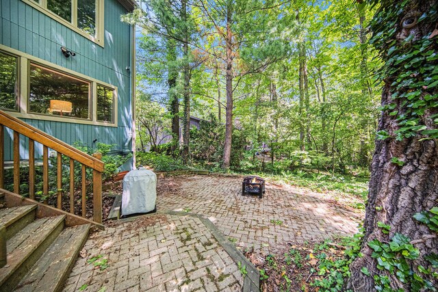 1410 N Folkstone Ct, Ann Arbor, MI 48105 - view of patio featuring a fire pit