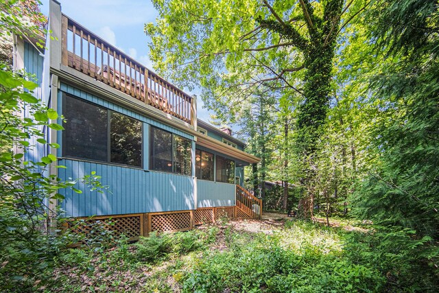 1410 N Folkstone Ct, Ann Arbor, MI 48105 - view of property exterior featuring a sunroom