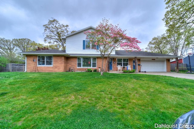traditional-style house featuring an attached garage, concrete driveway, and brick siding