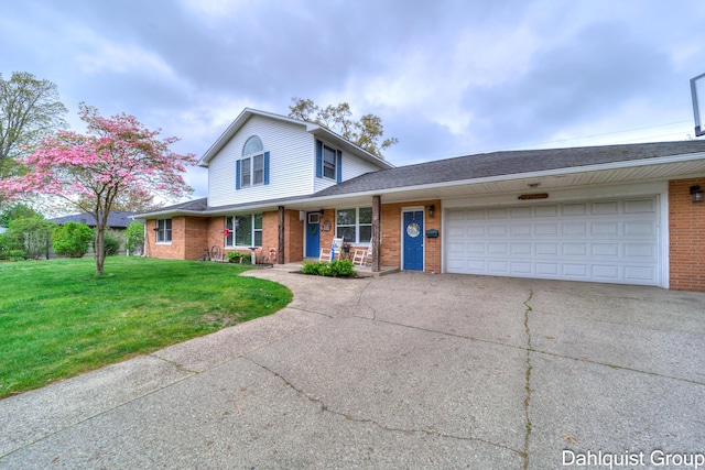 traditional-style house with concrete driveway, brick siding, a front yard, an attached garage, and a porch