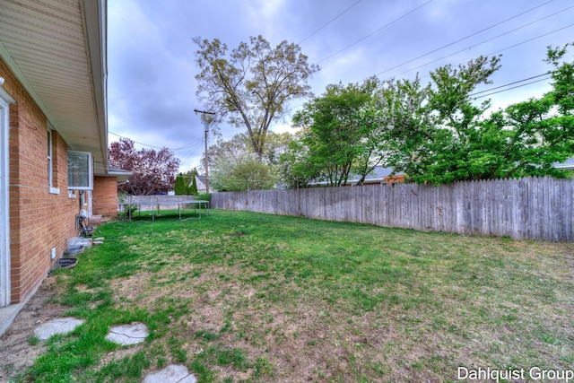 view of yard with a trampoline