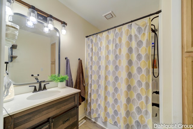 full bath featuring a shower with curtain and vanity