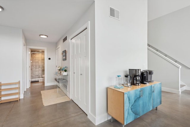 7469 Lake Solis Dr, Stevensville, MI 49127 - corridor featuring concrete floors and baseboards